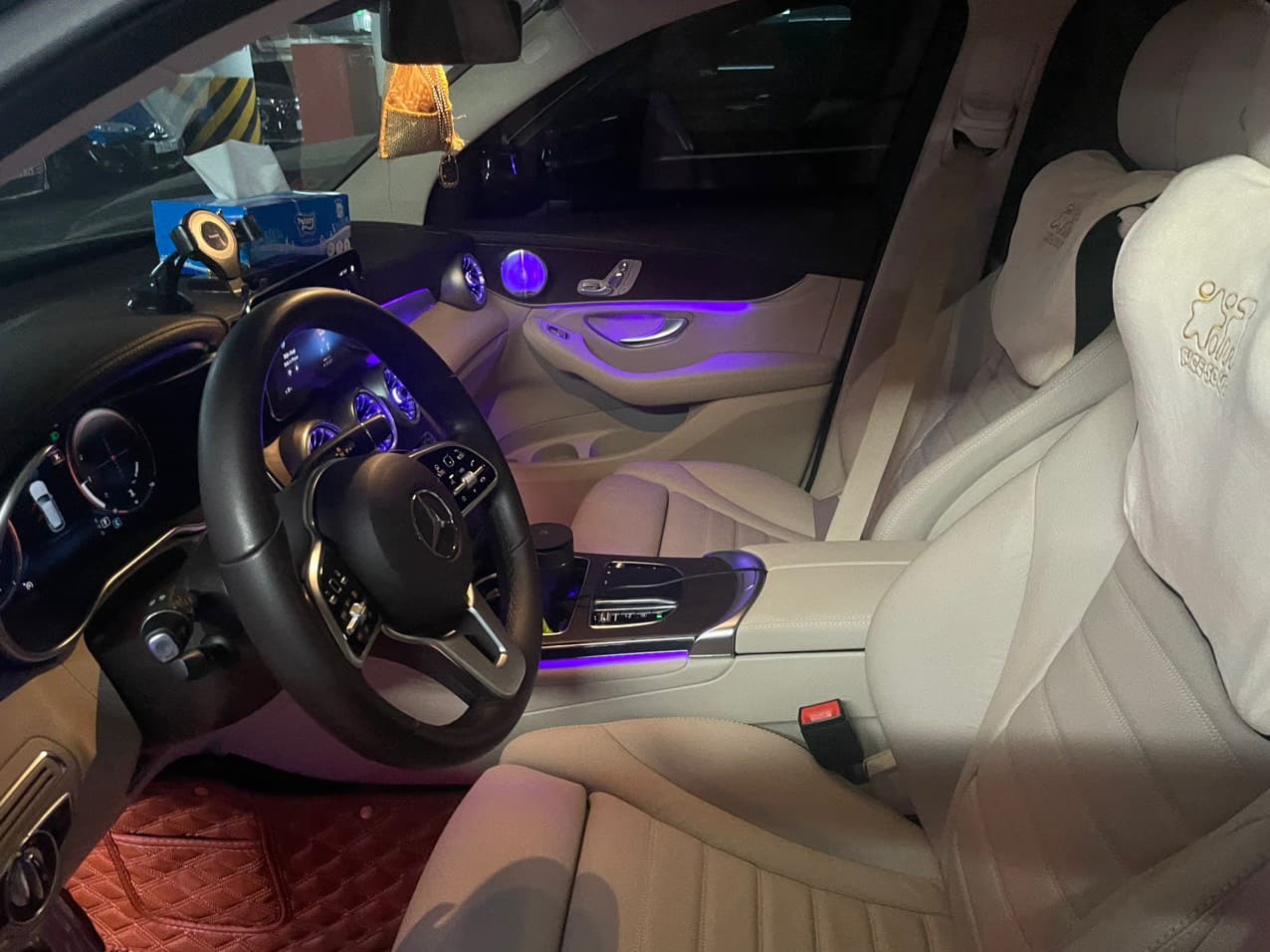 Mercedes-Benz GLC interior with cream leather seats and ambient lighting