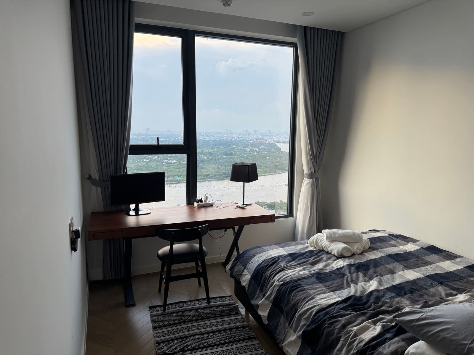 Bedroom with desk and panoramic river view